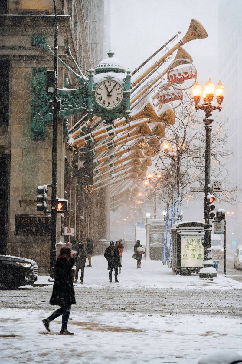The Marshall Field's clock on State Street in snowfall